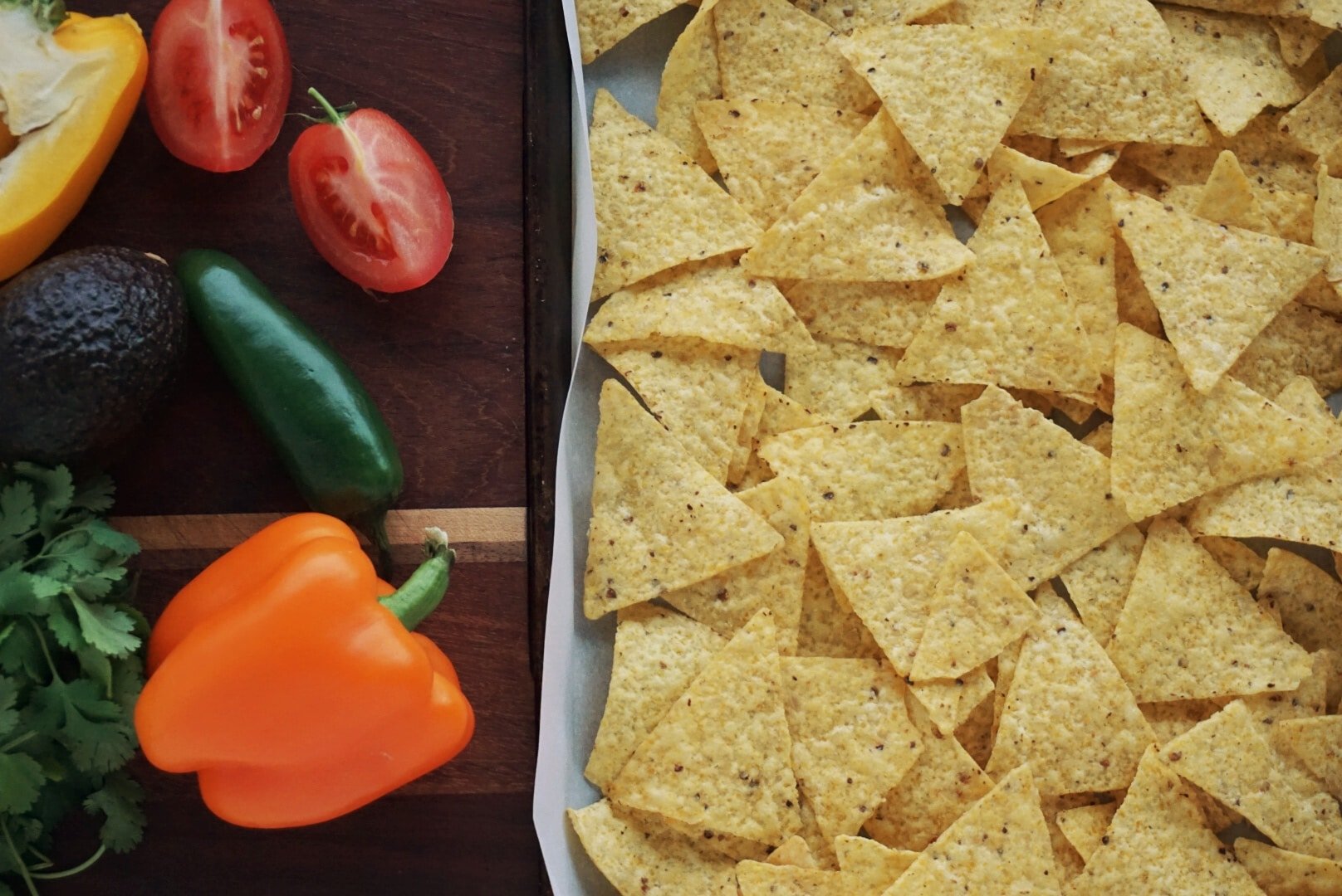 Tray of tortilla chips, peppers and tomatoes